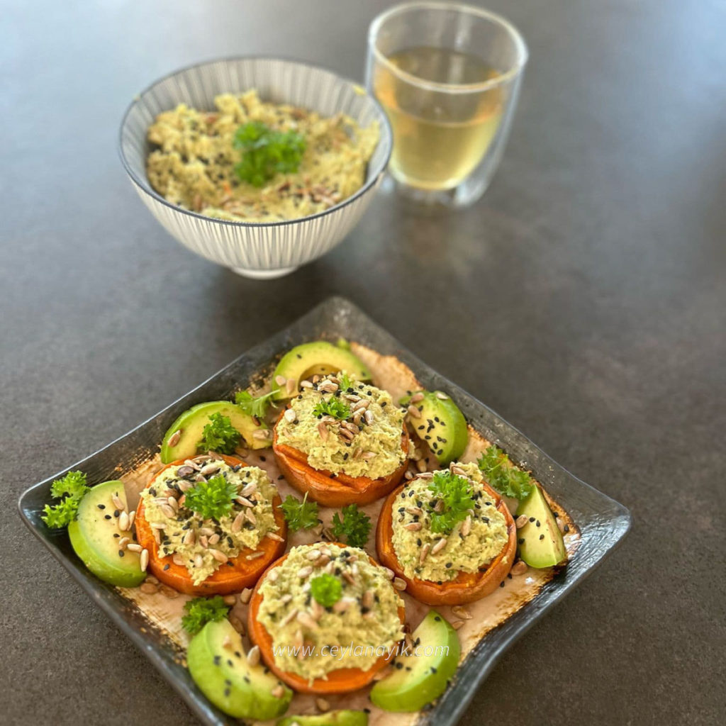 green hummus on sweet potato