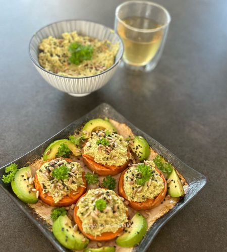 green hummus on sweet potato